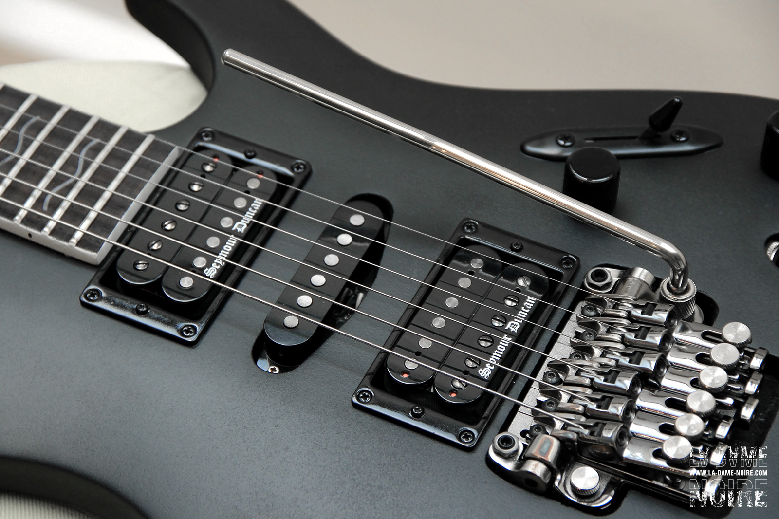 Picture of the guitar body painted in black with new humbuckers Black Winter